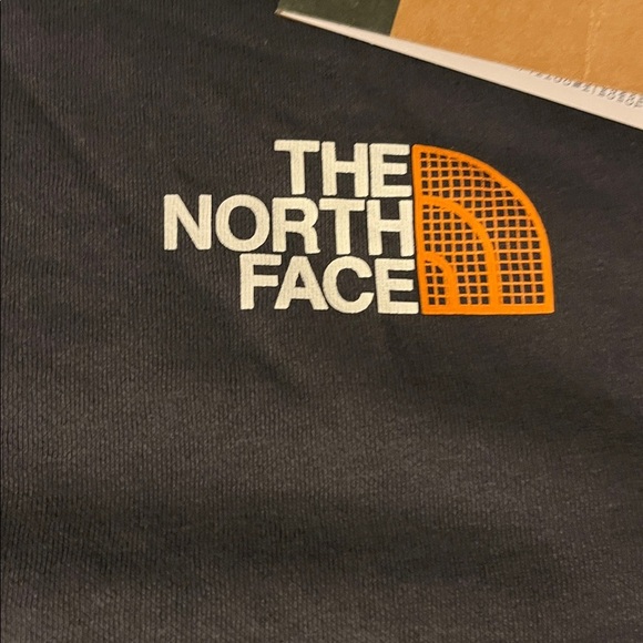 The North Face Charcoal Hoodie with Vibrant Orange Sleeve Design - Picture 5 of 14
